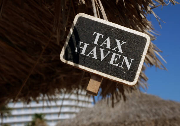 Tax haven sign on wooden plate. Tax haven sign on wooden plate.